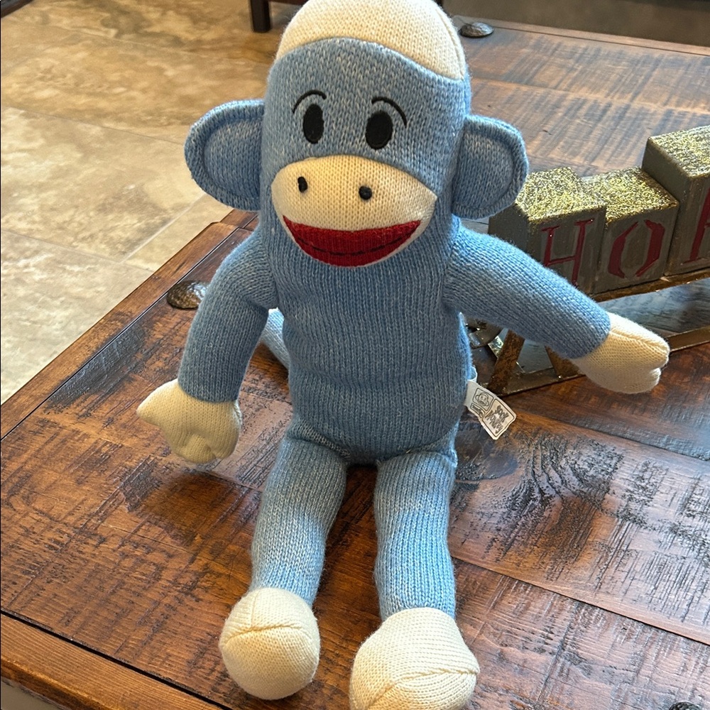 Charming Blue Sock Monkey Plush 
One nose hole is more loose than the other